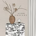 Dried Branches In Ceramic Vase On Marble Countertop With Decorative Ball And Books