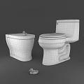 Two White Toilets With Rubber Duck on Top and Another on Floor