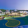 Scenic Camping Site With Tents Green Lawn And Outdoor Gathering Area