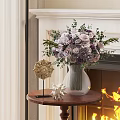 Purple and White Roses in Glass Vase with Green Leaves on Small Table by Fireplace with Star Decor
