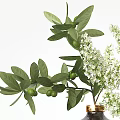 Gray Textured Vases With Gold Lids Green Foliage And White Flowers On Wooden Table