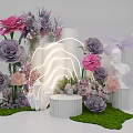 Floral Installation with Pink Purple Flowers White Columns Neon Light Statue and Green Grass Base