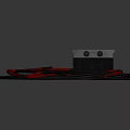 Modern Household Electrical Appliance With Coiled Black And Red Cables On Dark Surface