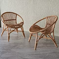 Two Rattan Outdoor Chairs Placed On Gray Floor With Beige Wall And Glass Door