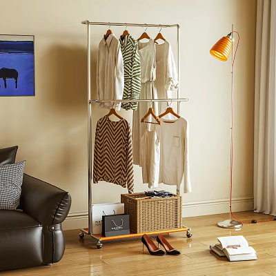 Metal Wheeled Clothes Rack with Hanging Clothes and Storage Basket in Living Room 3d model