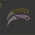 Two Metal Karambit Knives With Curved Blades And Finger Hole Handles