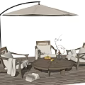 Wooden Outdoor Chairs With Armrests And Cushions Near Round Table And Umbrella