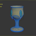 Elegant Golden Decorative Cup With Blue Accents And Intricate Patterned Base