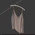 Beige Camisole Hanging on Rope with White Hanger Against Dark Blue Background