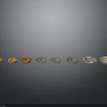 Carved Coin Sculptures In Different Colors Arranged In A Row With Metallic Finish
