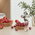 Fresh Red Apples in Woven Baskets Scattered on Table with Robot Model Vase and Books