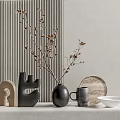 Black Vase With Branches On White Countertop Near Gray Mug Wooden Tray And Striped Wall