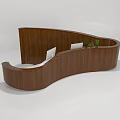 Modern Curved Wooden Reception Desk With Decorative Plants And Photo Frames On Counter
