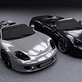 Two Silver And Black Convertible Sports Cars With Shiny Exterior Design