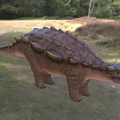 Prehistoric Reptile With Scaly Armor Back Spikes And Robust Body In Natural Woodland Habitat