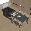 Modern Dining Table Set with Black Marble Top Wicker Chairs and Decorative Books