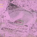 Ancient Circular Theater Ruins Surrounded by Trees and Rocky Archaeological Site