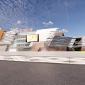 Modern Architectural Building Facade With Metal Panels Spacious Plaza Entrance Area