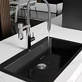 Modern Black Kitchen Sink With Stainless Steel Faucet Water Flowing On White Marble Countertop