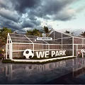 WE Park Outdoor Recreational Area Featuring Soccer Ball Fence And People Activities