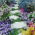 Beautiful Garden Path Surrounded By Colorful Flowers And Lush Green Leaves