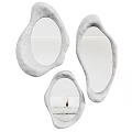 Three Unique Gray Organic Shaped Decorative Mirrors Reflecting Interior Design