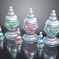 Decorative Glass Bottles In Various Sizes With Silver Bases And Colored Liquids