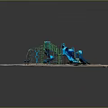 Playground Equipment In Circular Sandy Area With Blue Slide And Green Climbing Structure