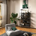 Modern Black Metal Shelving Unit In Living Room With Green Plants And Decorations