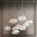 Elegant Modern Glass Chandeliers with Transparent Shades Hanging in Interior