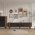Vintage Wooden TV Stand With Decorative Wall Frames Potted Plant And Round Rug