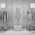Modern Clothing Display Rack with Hanging Apparel Bags Shoes Decorative Plants and Black White Labels