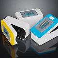Pulse Oximeters in Yellow White Blue with Digital Display Readings on Black Background