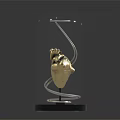 Golden Heart Model Medical Device With Glass Dome And Black Base