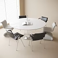 Round White Table with Six White and Black Chairs Open Book Clear Vase Indoor Room