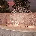 Modern Spiral Wire Sculpture In Outdoor Public Area With People And Trees