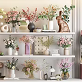 Decorative Shelf Arrangement with Various Flower Vases Colorful Blooms and Rabbit Figurine
