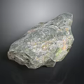 Natural Rock With Green And Brown Surface Texture On Dark Background