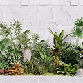 Diverse Lush Plant Combination With Green Foliage Stones And Gray Stone Wall