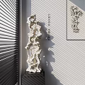 White Intricate Carved Sculpture With Hollow Patterns And Indoor Light Shadow