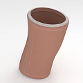 Brown Curved Hollow Tubular Fabric Object With White Rim And Stitched Surface