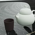 Elegant White Teapot And Dark Brown Cup In Modern Tea Set On Black Patterned Countertop