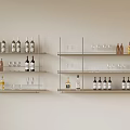 Modern Metal Display Shelves Organized With Wine Bottles Liquor And Glassware