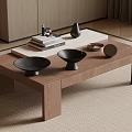 Wooden Coffee Table With Stacked Books Black Vase And Decorative Bowls In Modern Living Room