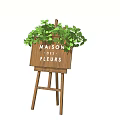 Easel Style Wooden Signboard with MAISON DE FLEURS Lettering and Green Leafy Plants