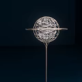 Illuminated Art Installation Featuring Spherical Wire Structure And Circular Rings On Thin Metal Stand 3d model
