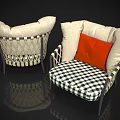 Woven Frame Armchair With White Cushions Orange Pillow And Black White Checkered Seat
