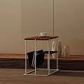Modern Side Table With Wooden Top And Metal Frame Featuring White Cup And Decorative Vases
