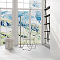 Inflatable Chair In Spacious Room With Large Windows Mountain View White Sink Black Ladder Shelf