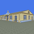 Traditional Yellow Building With Blue Decorative Roof Windows Doors And Paved Square Front